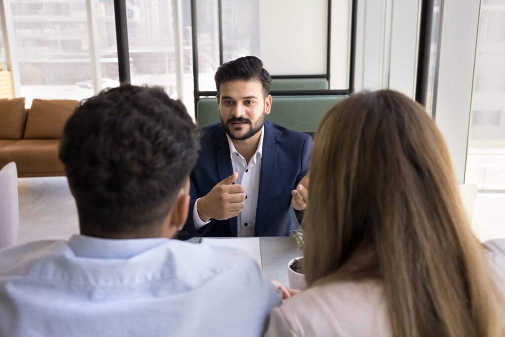 Business owners talking to a customer retention strategist